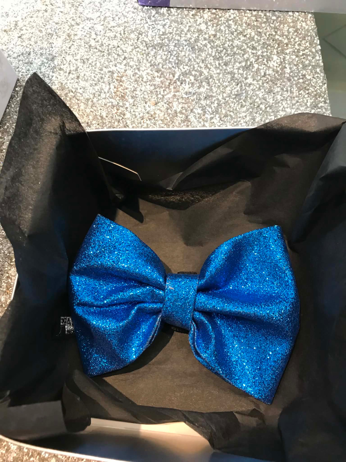 Blue glitter dog bow tie presented in a gift box